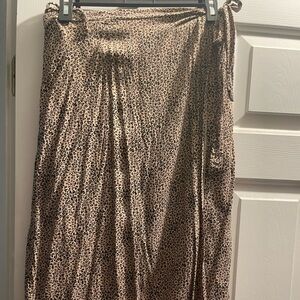 Tan and black tie skirt. Two ties with open slit on the left side